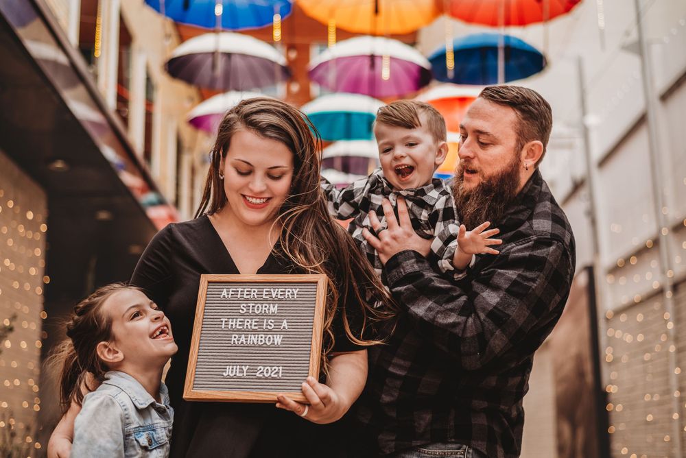 family of 4 with pregnancy announcement