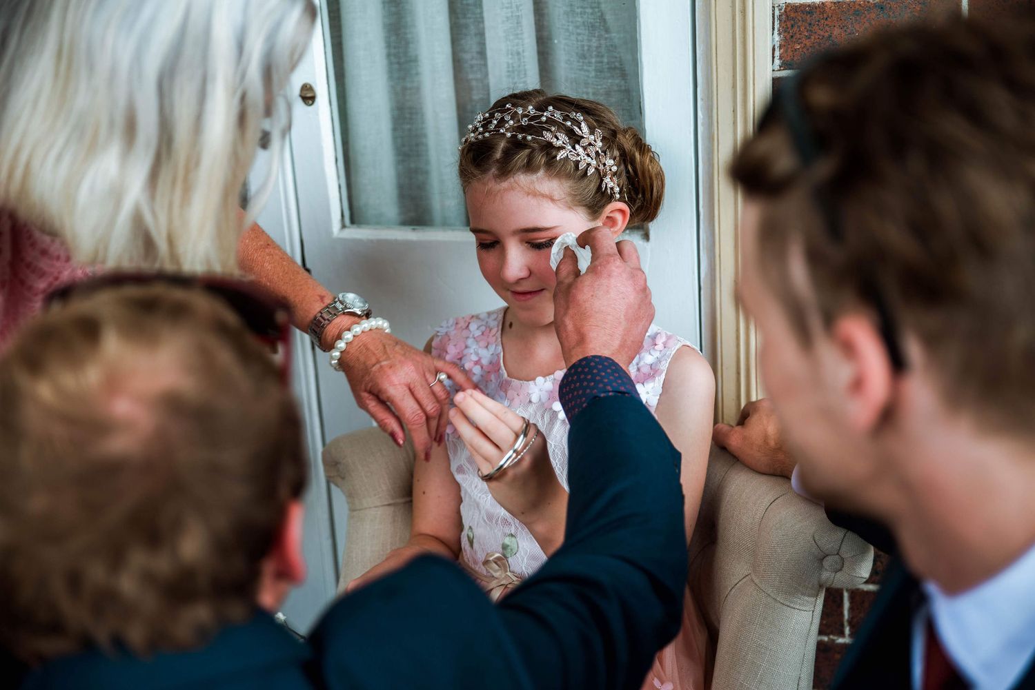 Close-up moment of wedding preparation with jewelry and accessories.