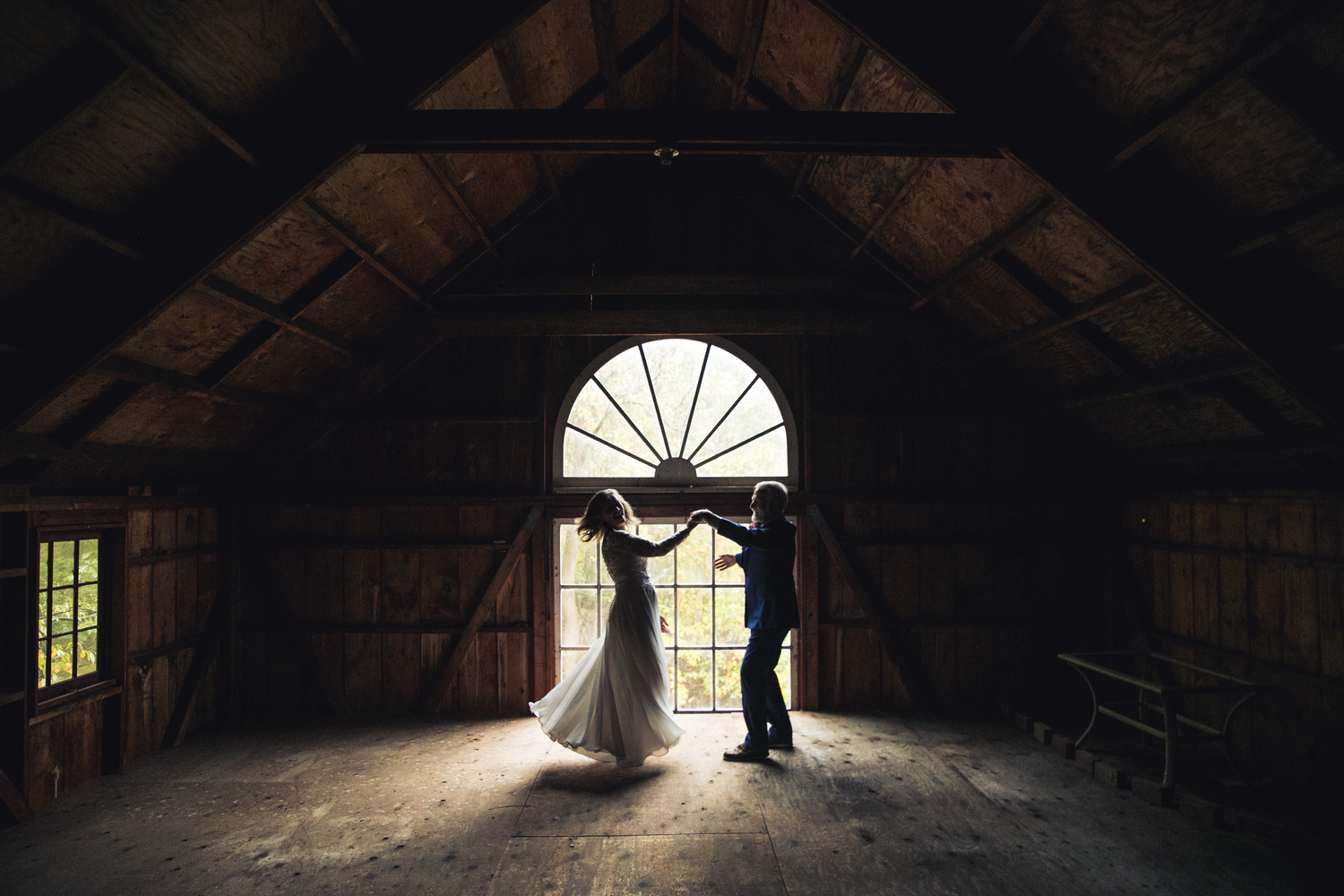 a couple dance inside a barn at a rustic wedding, Pennsylvania