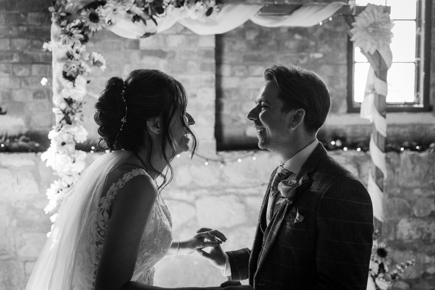 bride and groom laughing during their wedding ceremony