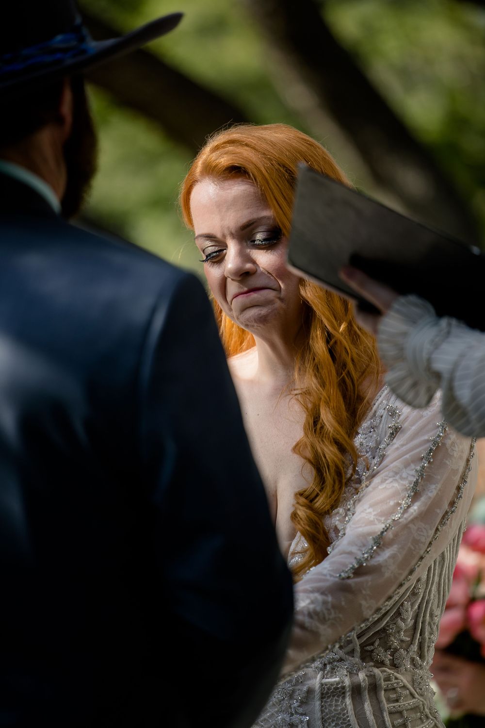 An emotional moment captured during a wedding ceremony with a vintage-inspired aesthetic.