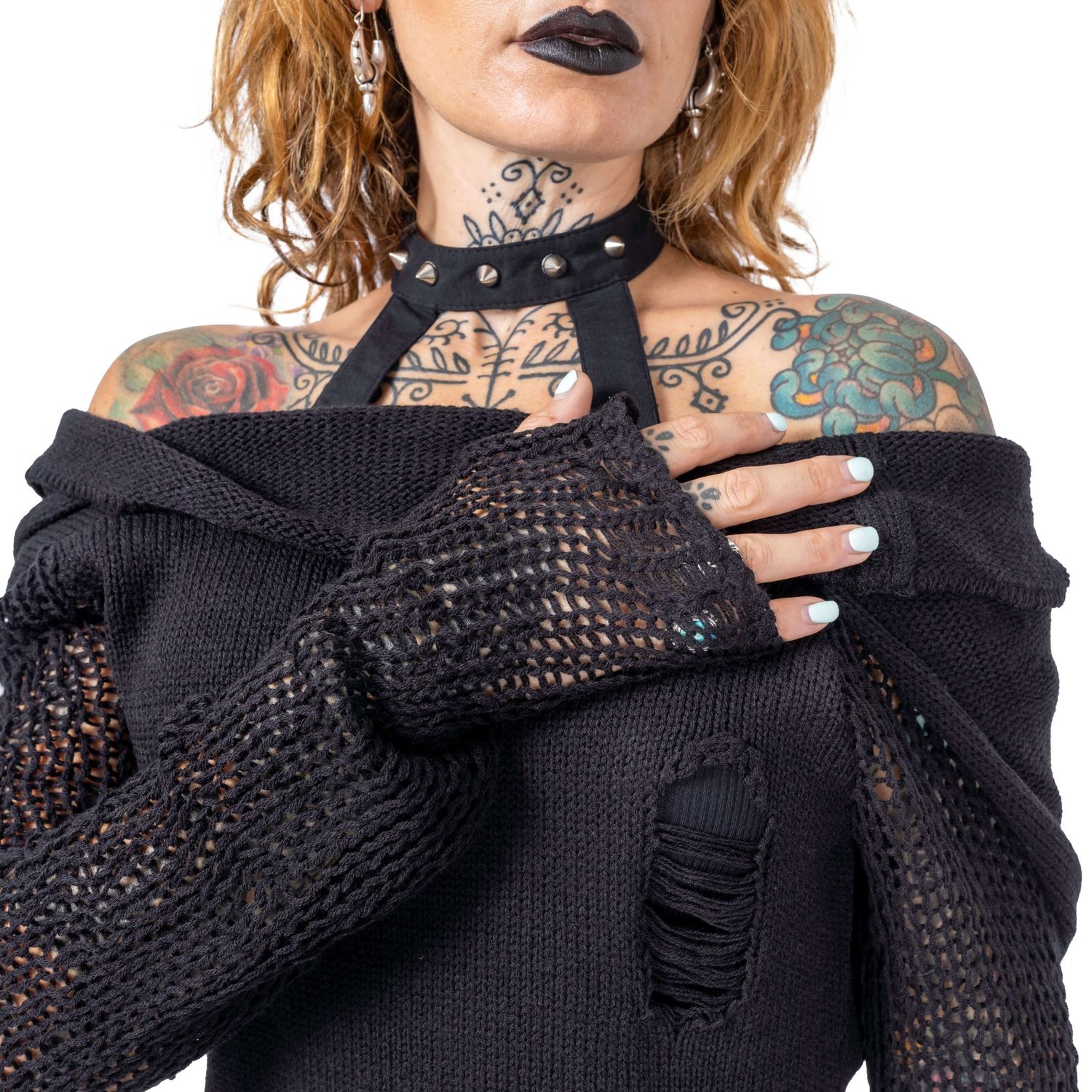 close up of tattooed model wearing gothic black jumper shot by Amy Davies for Innocent Clothing in Hove studio