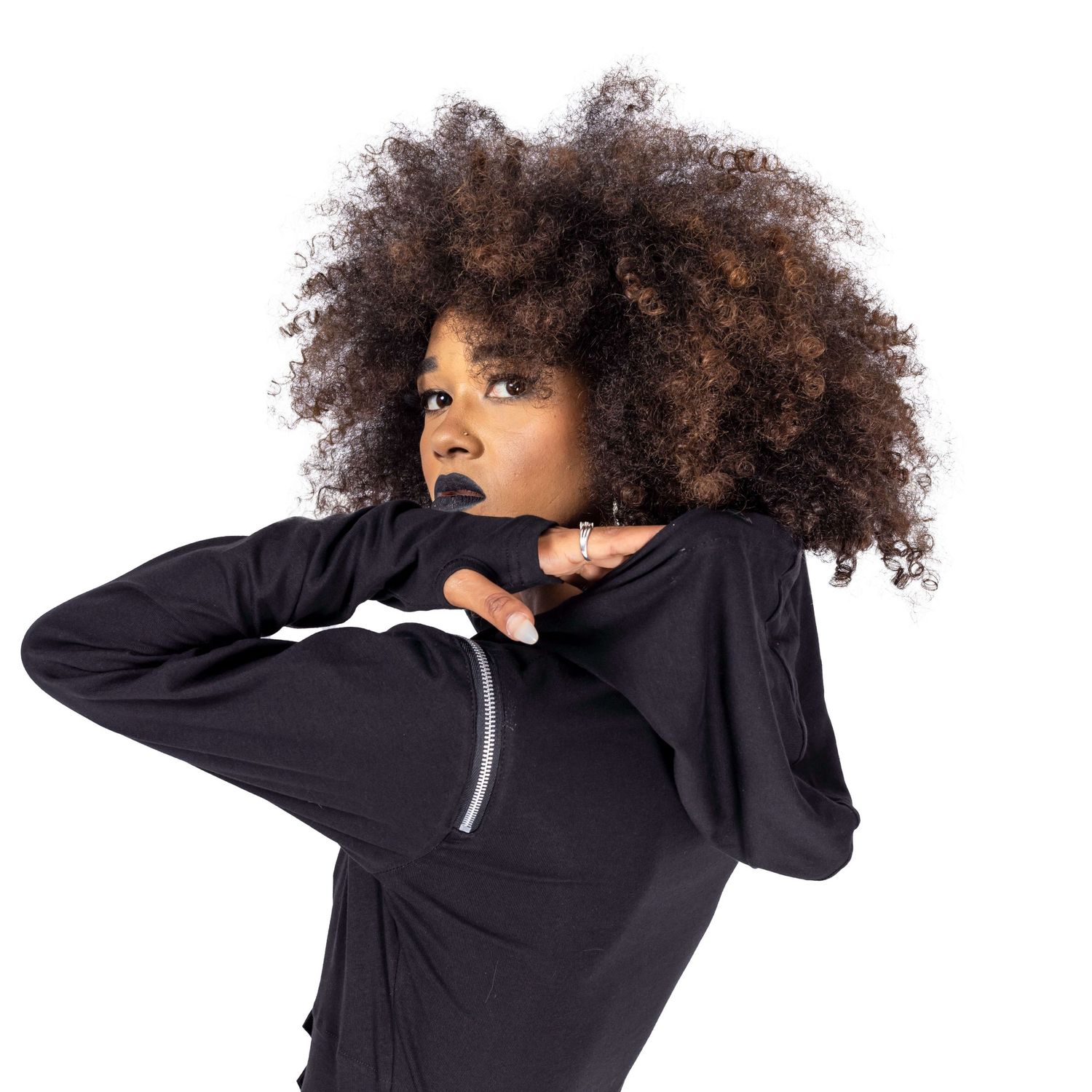 model with afro hair and black lipstick posing for Innocent Clothing in gothic hoodie shot by Amy Davies in Hove