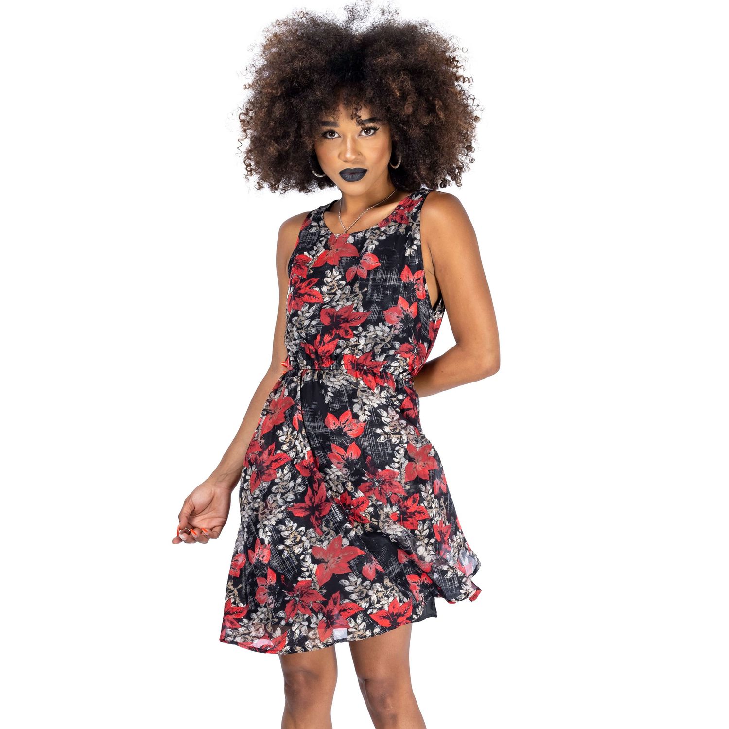model with dark makeup and afro hair posing for Innocent Clothing wearing gothic dress shot by Amy Davies in Hove studio