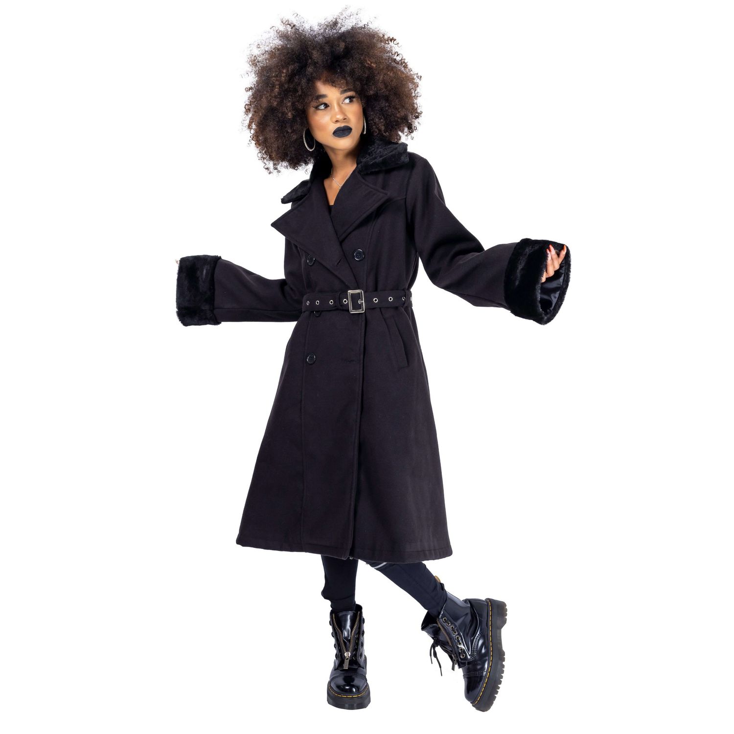 model with dark makeup and afro hair posing for Innocent Clothing in gothic trench coat shot by Amy Davies in Hove