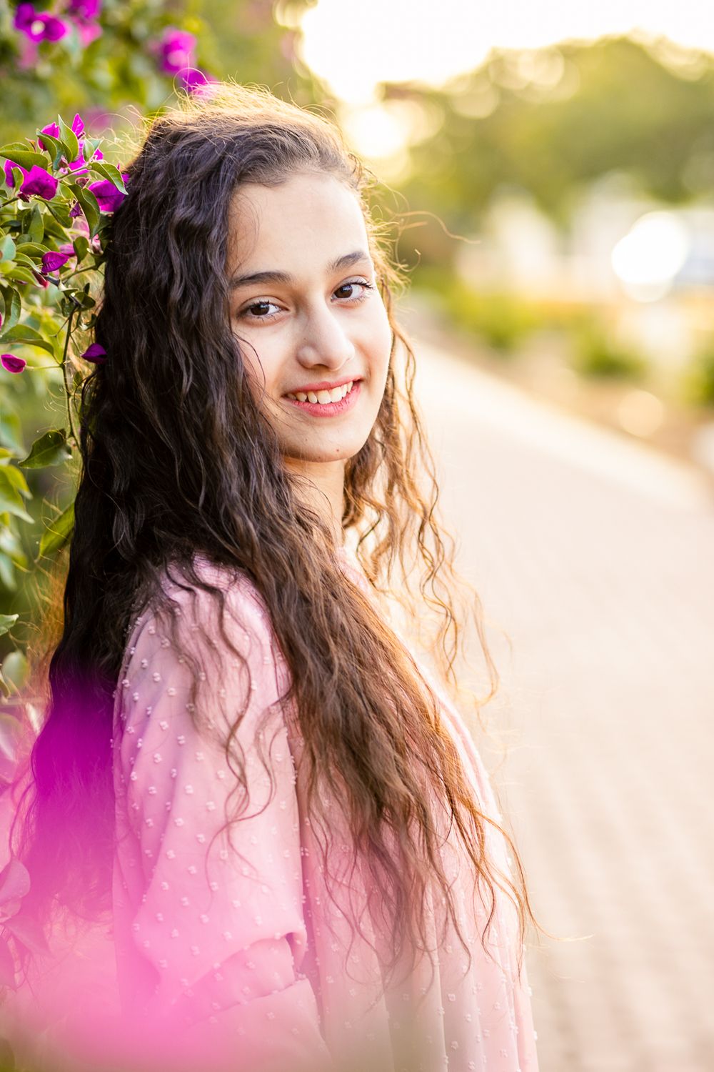 Portrait of a smiling girl and sunlight in her hair