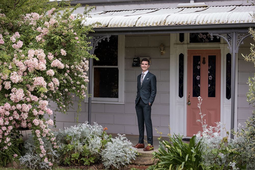 Groom in a Green wedding suit before his St.Leonards Vineyard winery wedding in Wahgunyah