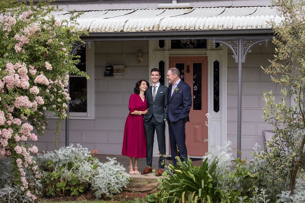 Groom sharing a moment with his Mum and Dad before his wedding at St.Leonards Vineyard winery wedding in Wahgunyah