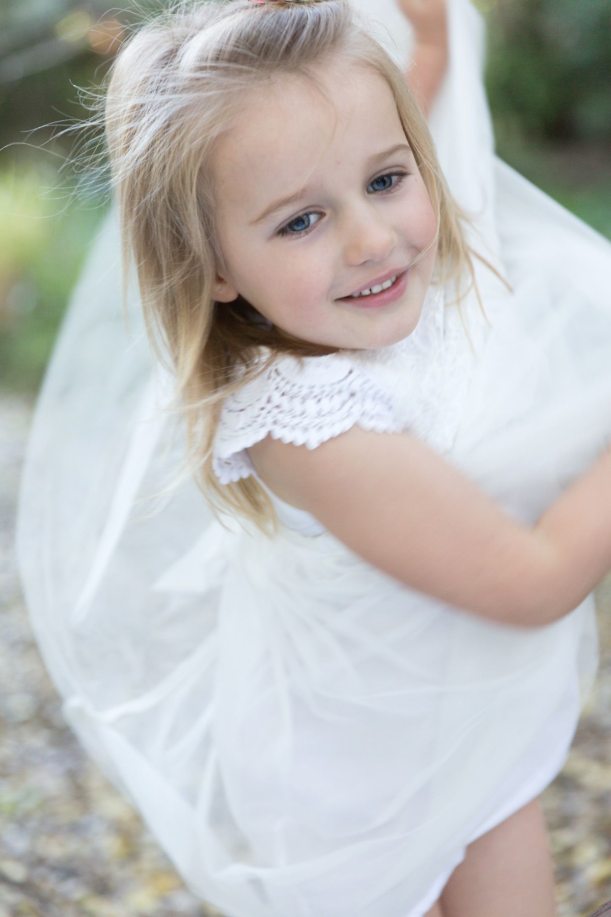 lifestyle natural family photographer ashgrove brisbane young girl swishing dress