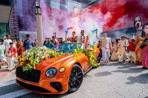 South Indian Wedding Photography in downtown Chicago Illinois. Downtown baraat chicago using smoke bombs and a Bentley.