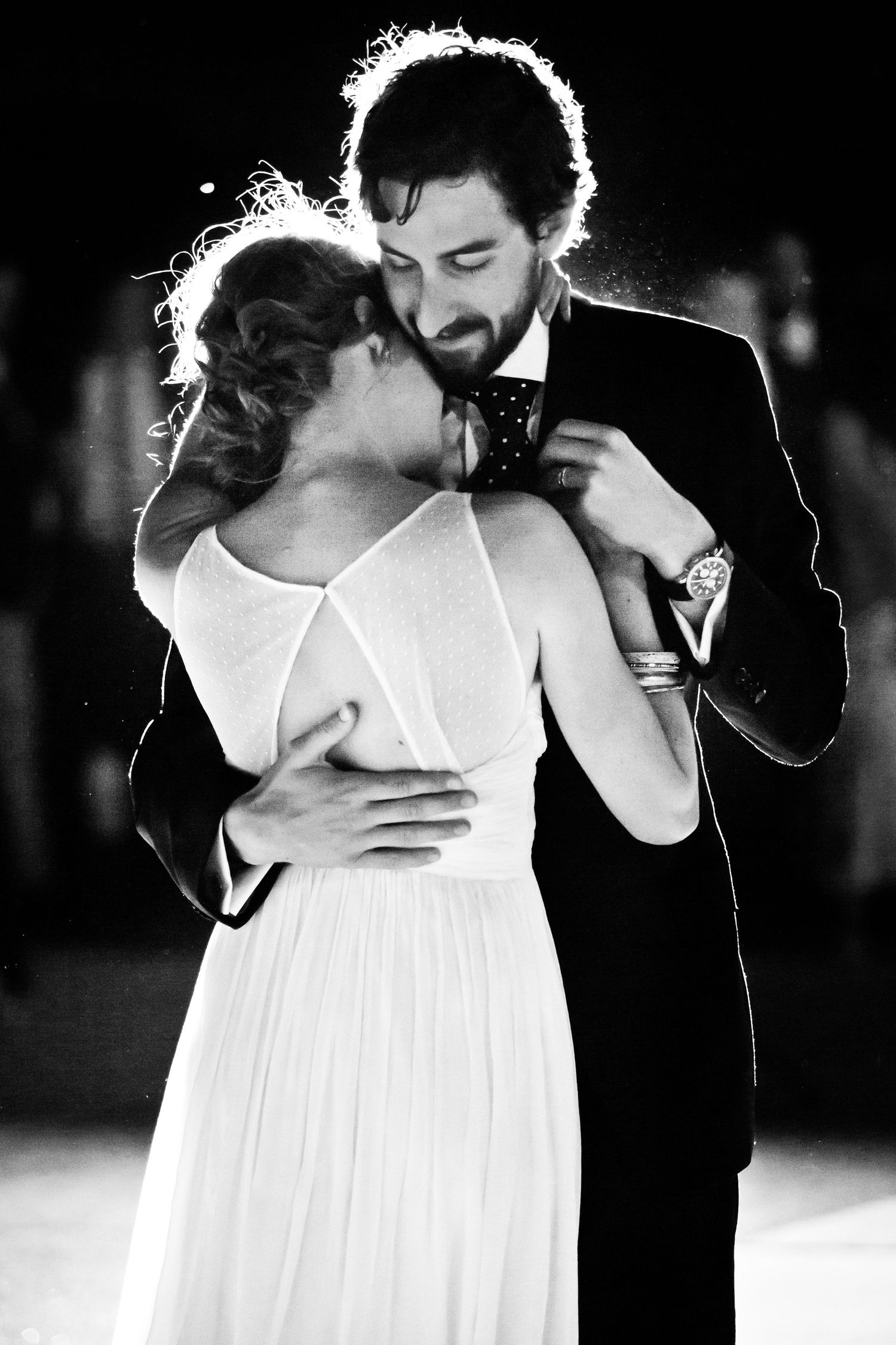 Black and white photo capturing an intimate dance moment at a wedding reception.