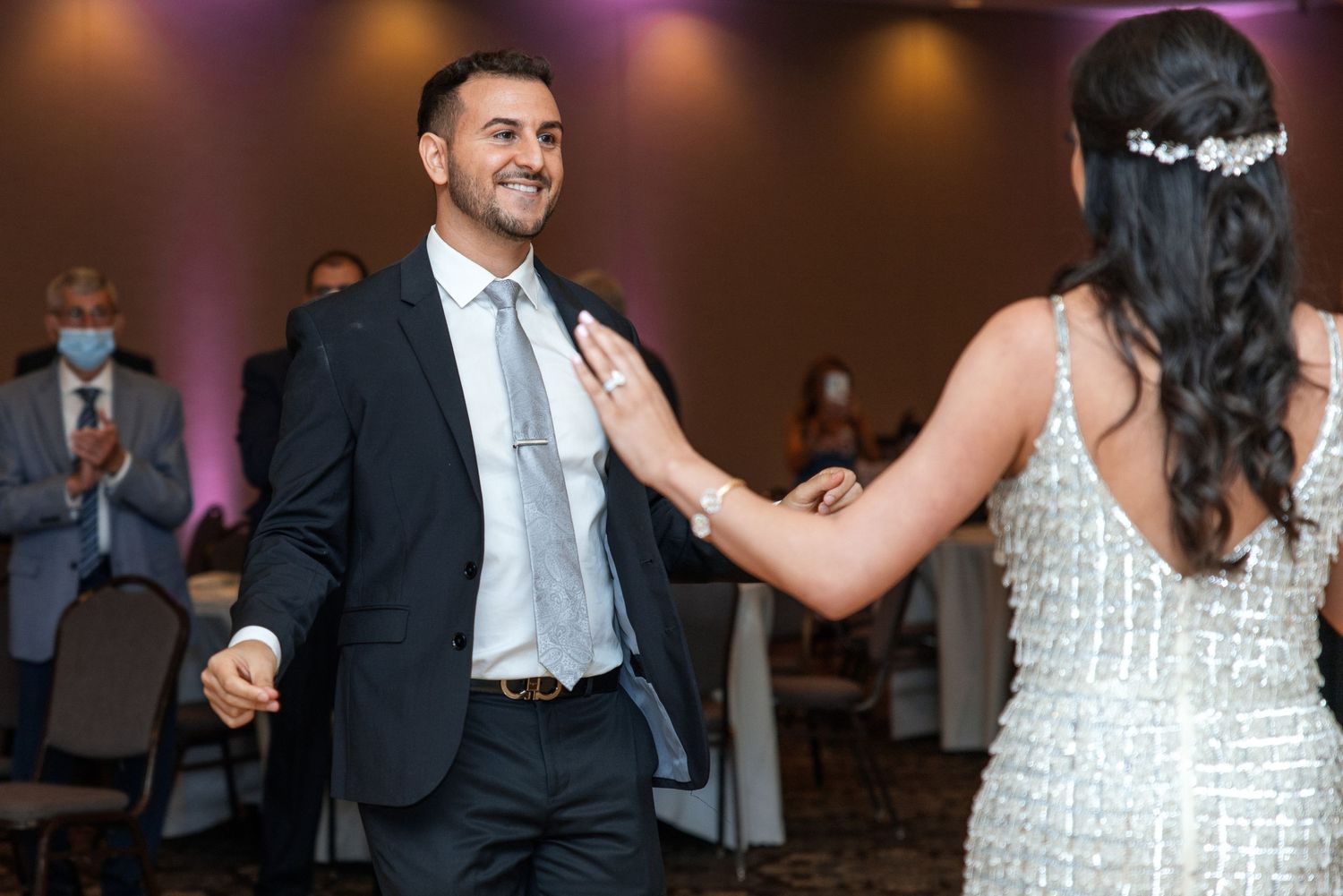 A couple dances together at their wedding reception.