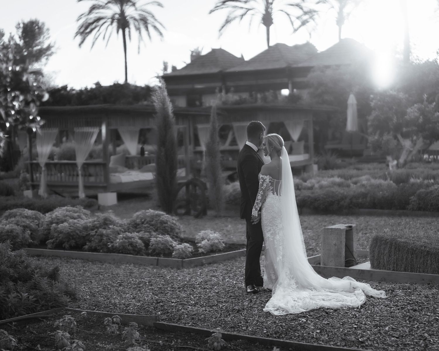 Black and white photo of Sean and Katie in the gardens of Atzaro in Ibiza.