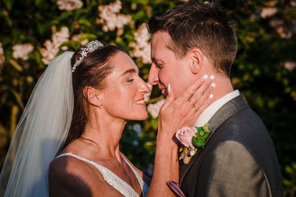 Bride and groom kiss at their Nottingham Wedding Reception