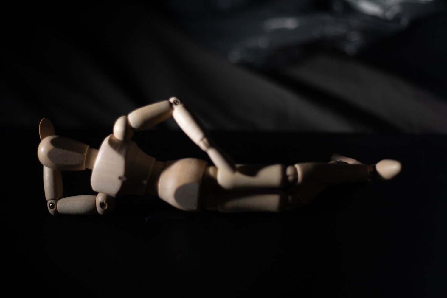 Meant as a joke. A wooden doll laying on it's side