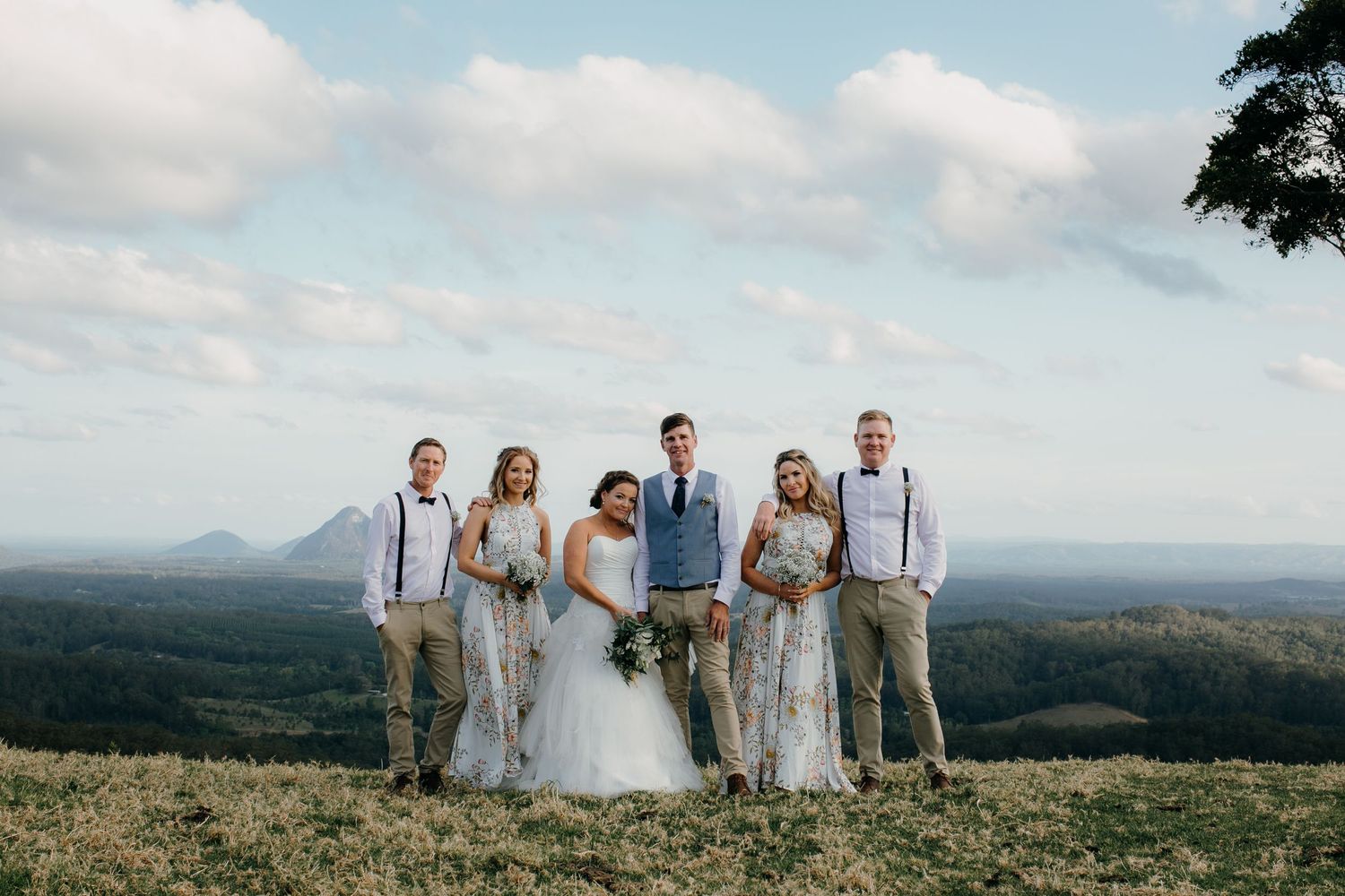 Maleny hill wedding photo with bridal party and mountains in the background