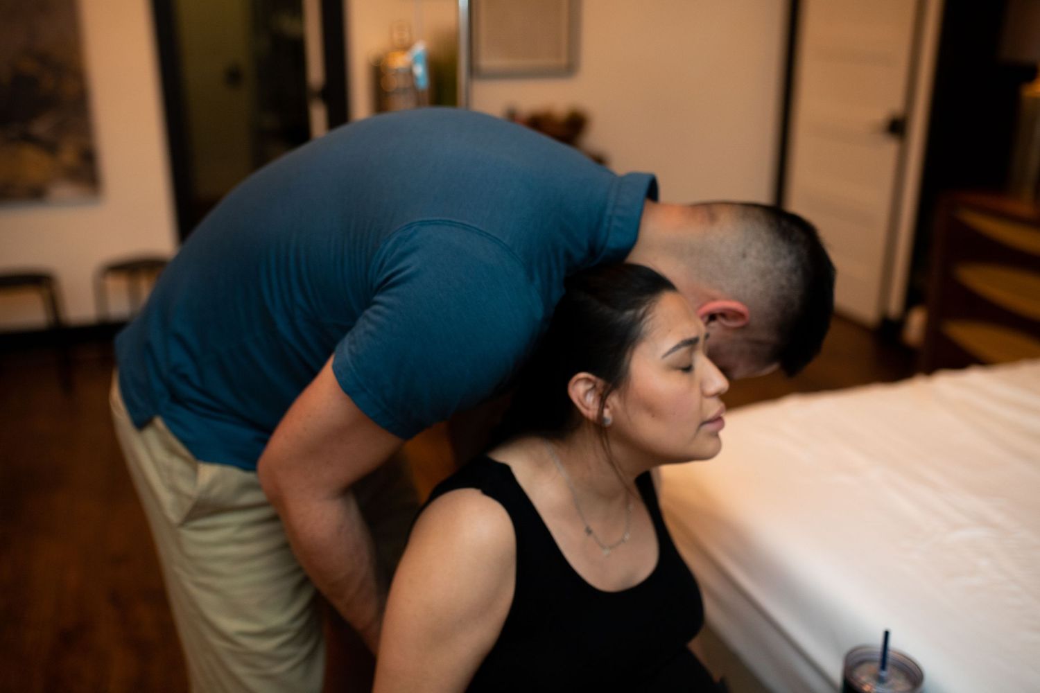Husband and Birth Partner Supporting Woman through Contraction at Origins Birth and Wellness Fort Worth