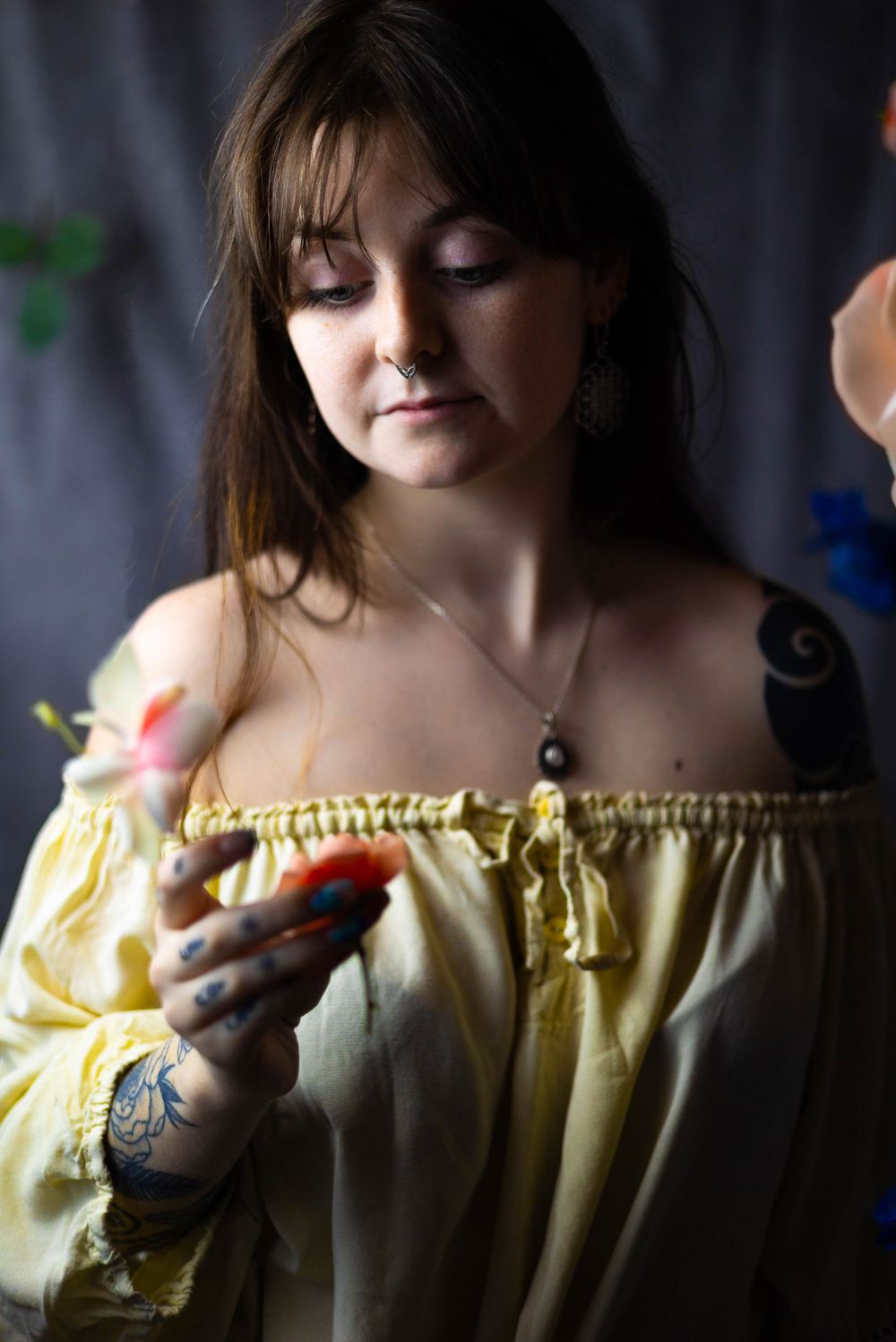 Moody portrait series featuring yellow peasant top and dramatic shadows.