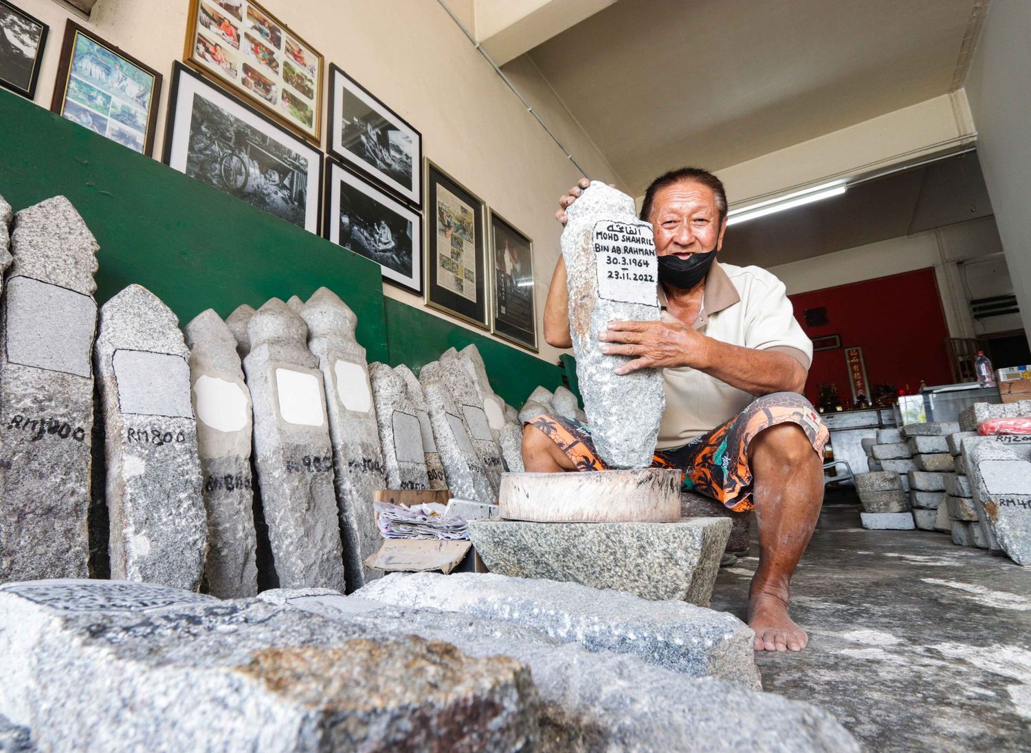 Mr. Kuah showed the tombstones that had been finished with carved names