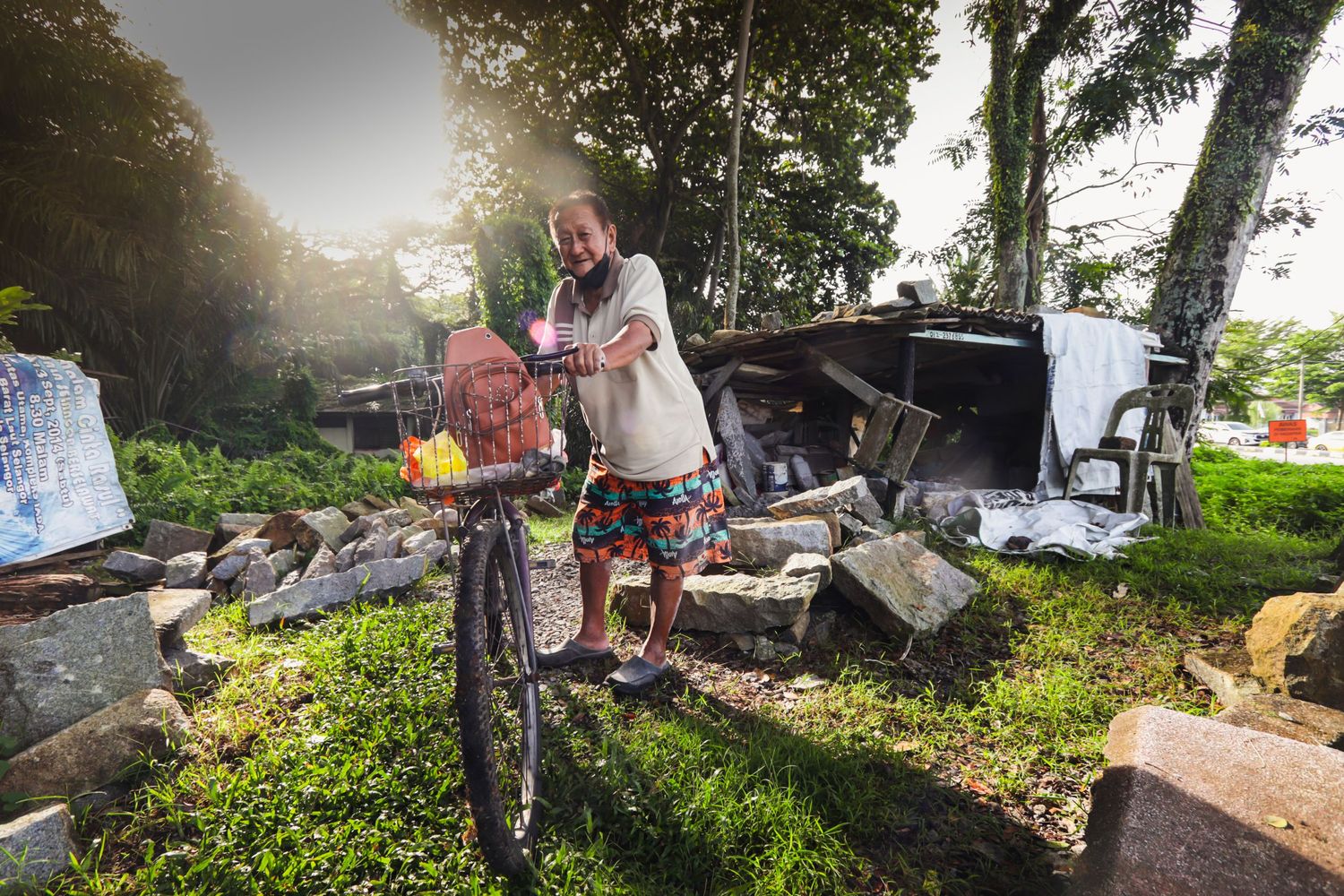 Mr. Kuah, his bicycle and his workplace