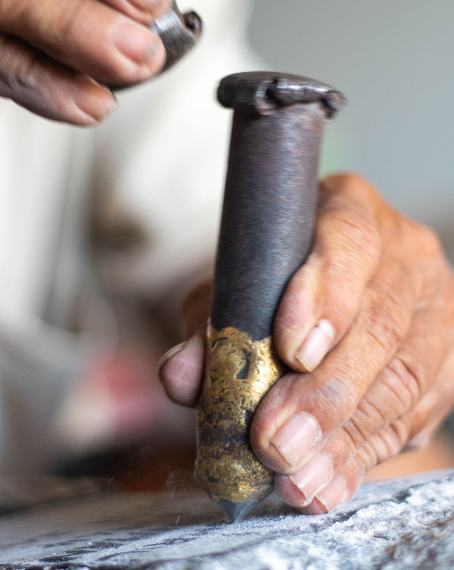 The tombstone is carved with a "special" nail in the second step before being inked