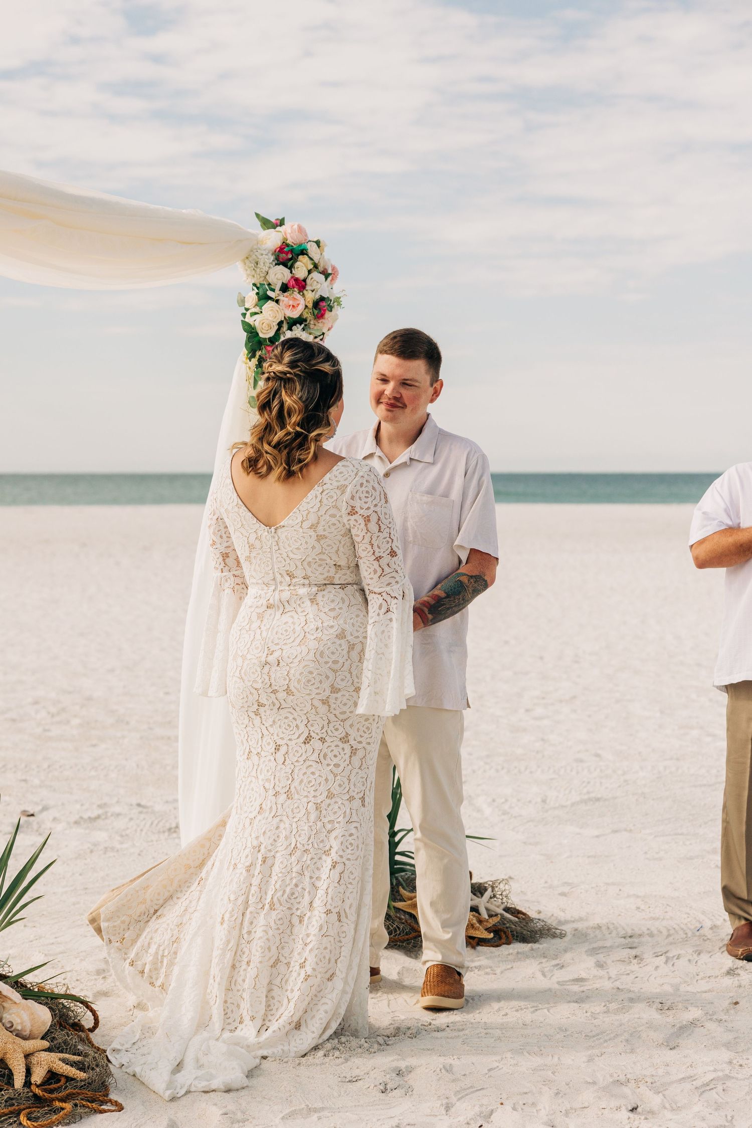 Bride and Groom saying their vows on Siesta Key beach photographed by Sarasota wedding Photographer Samantha Brown