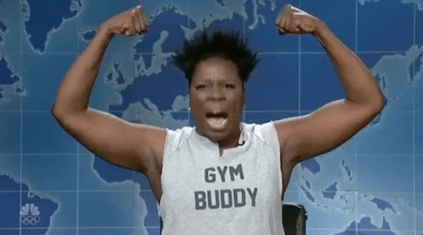Enthusiastic person in Gym Buddy tank top flexing arms against map backdrop.