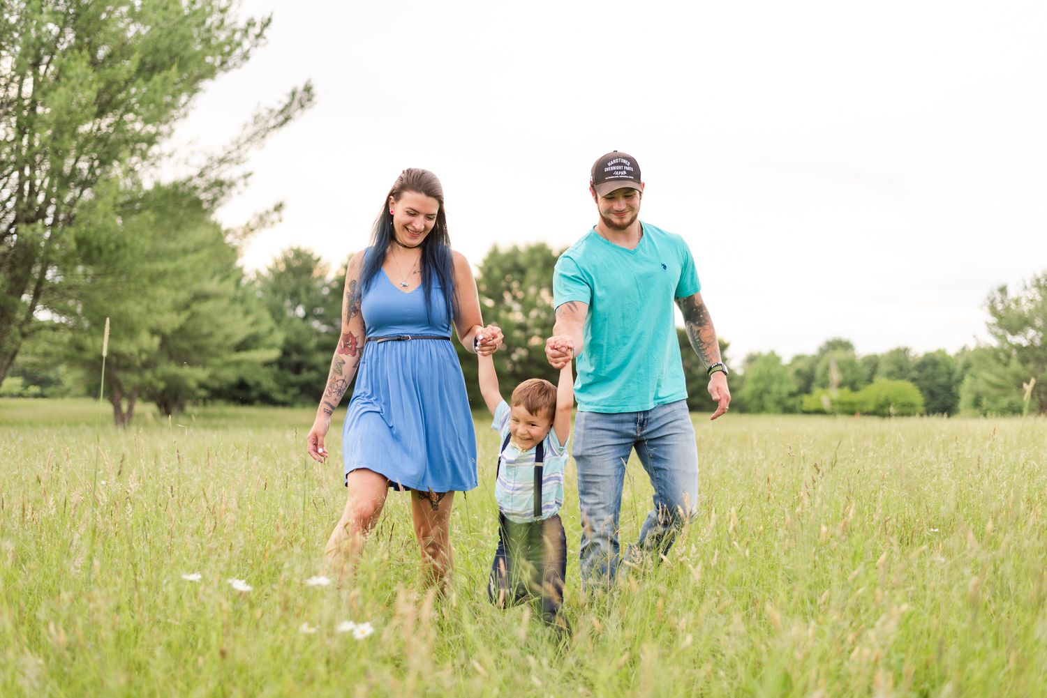 Family running through field in Clarion Pennsylvania