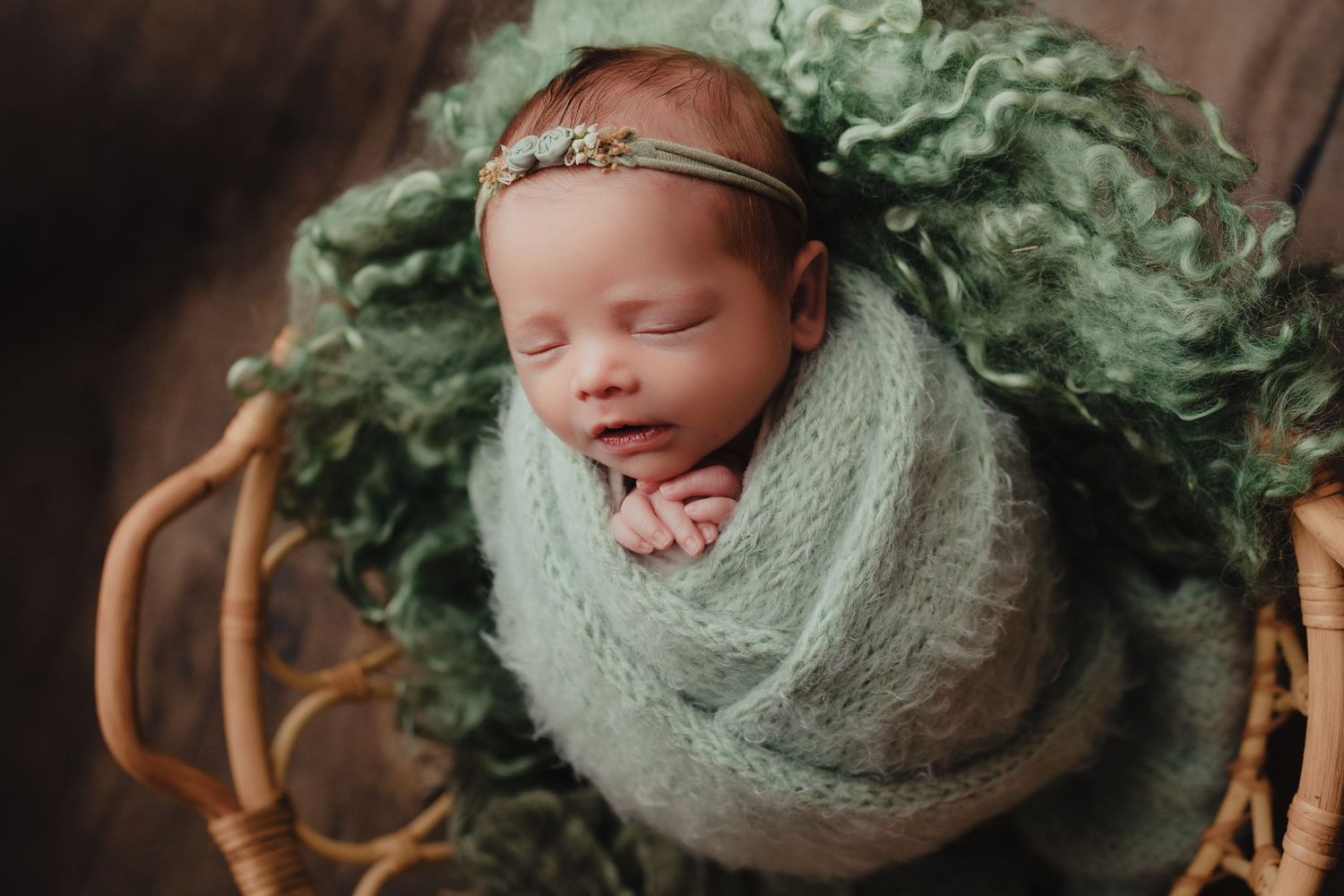 baby girl wrapped in basket baby photo
