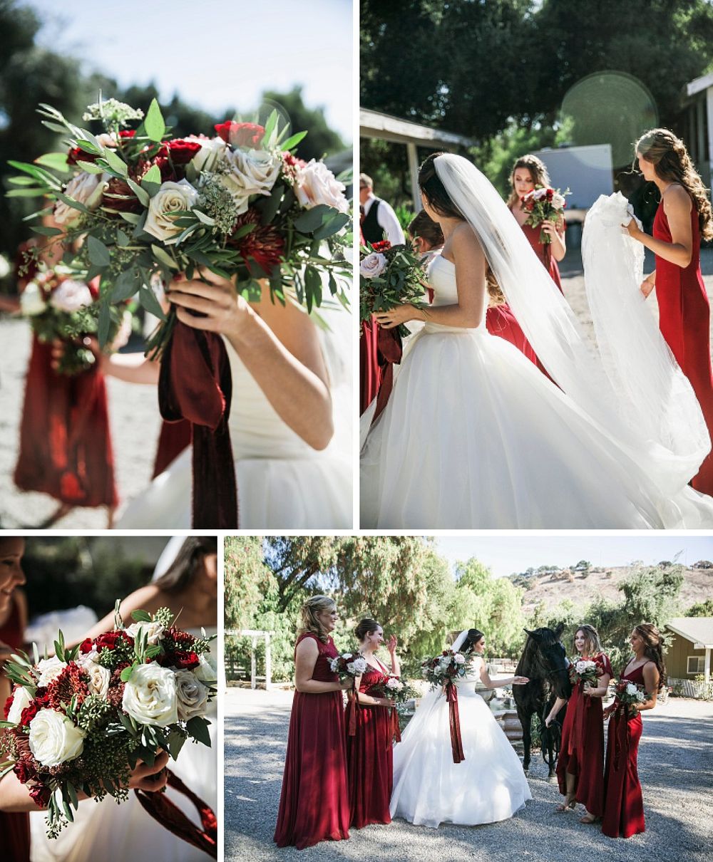 Beautiful wedding scene featuring burgundy bridesmaid dresses and elegant white and red floral bouquets on a sunny day.