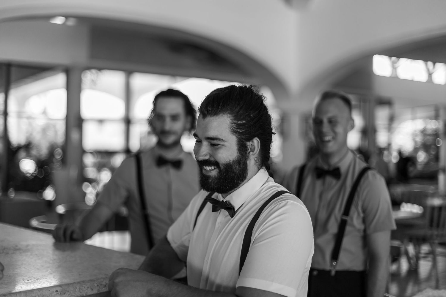Groom and best men at the hotel bar getting a beer