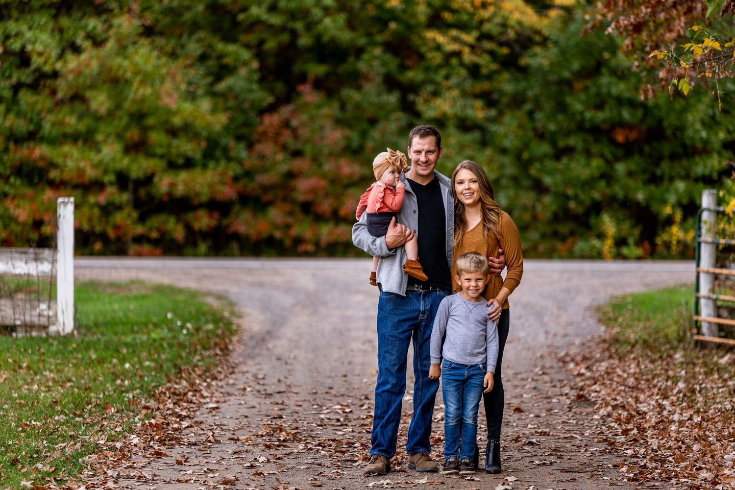 Family posed on a fall day.
