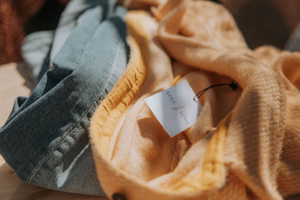 Close-up view of vintage-style fabrics and textiles with warm tones and soft textures.