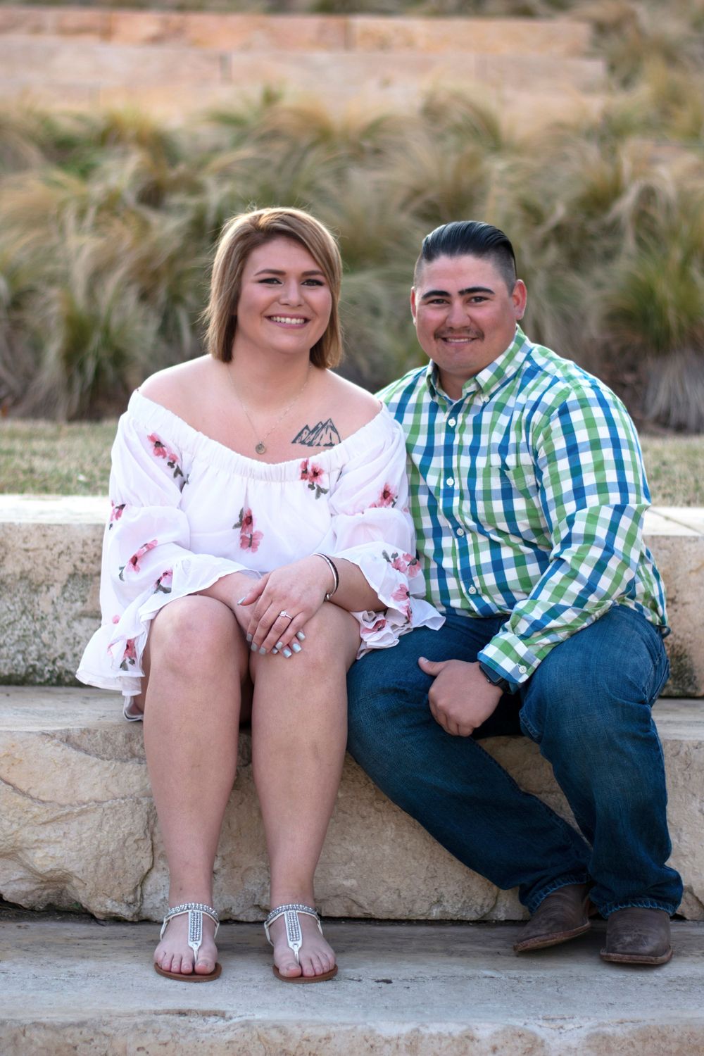A young couple poses in Oklahoma City for their engagement shoot