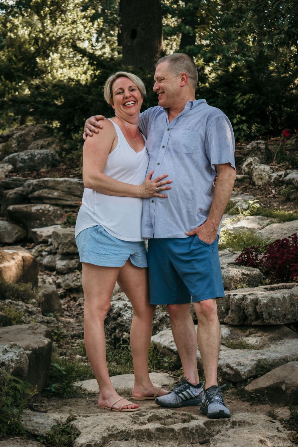 A couple smiles fondly as they pose for camera