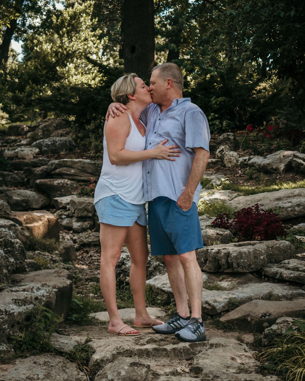 An older couple steals a kiss when they think the camera isn't looking