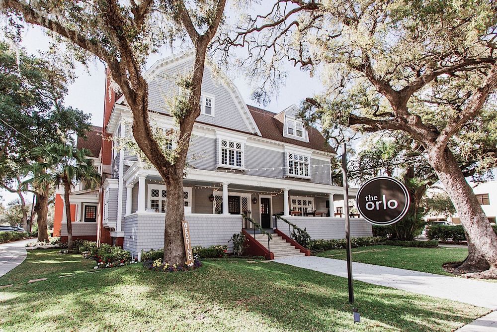 The Orlo, a historic wedding venue in Tampa, FL which is a gray two story house
