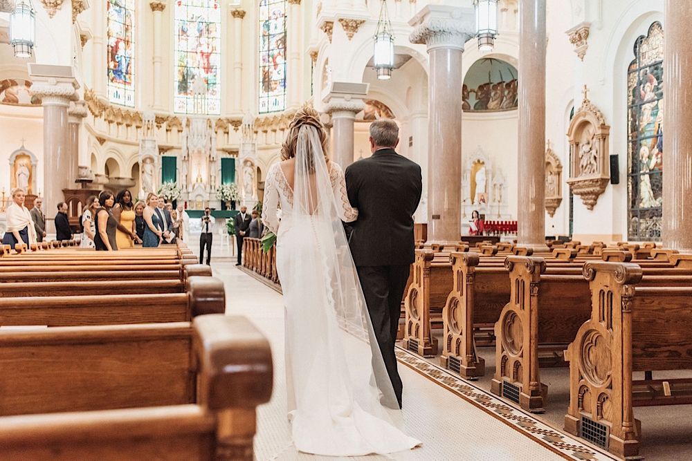 Father walking bride down the aisle at Sacred Heart Church in Tampa