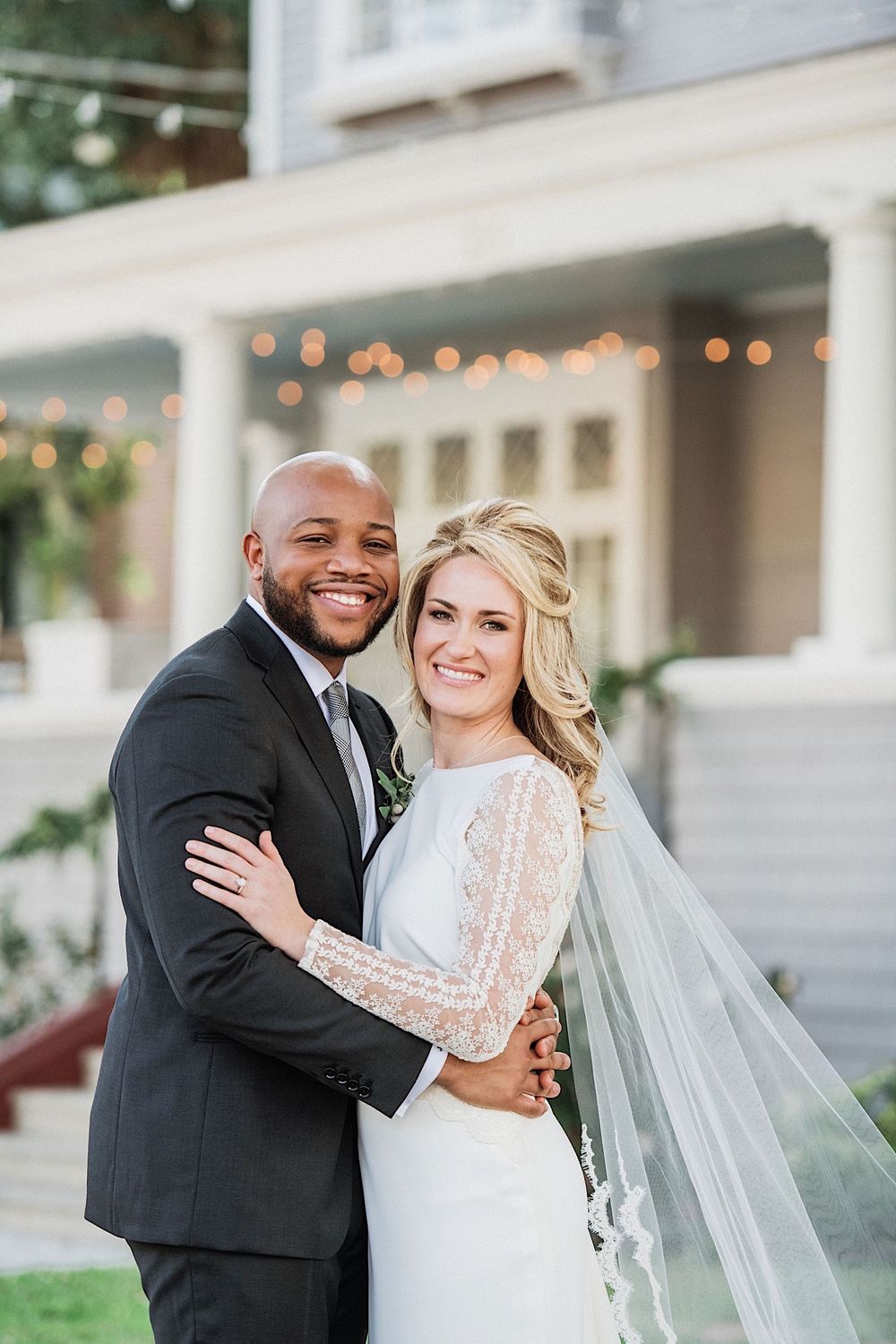 close up of bride and groom smiling in front of the Orlo in tampa