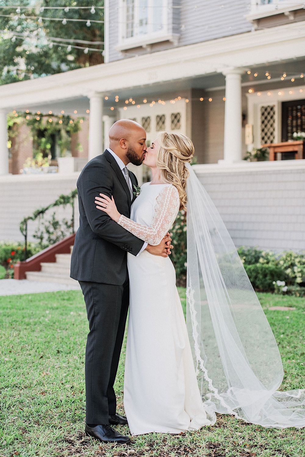 brise and groom kissing in front of the Orlo at their wedding