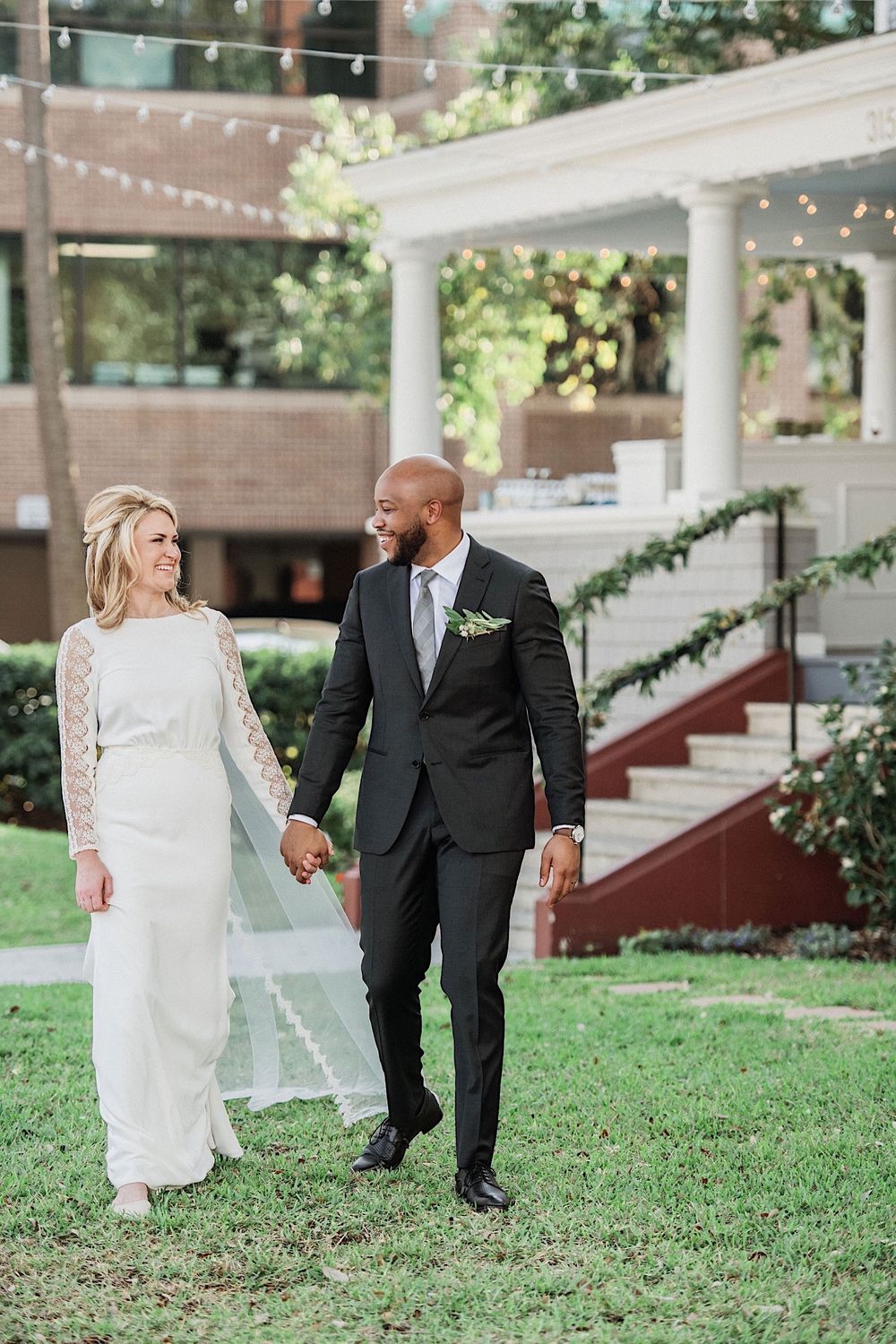 bride and groom walking hand in hand
