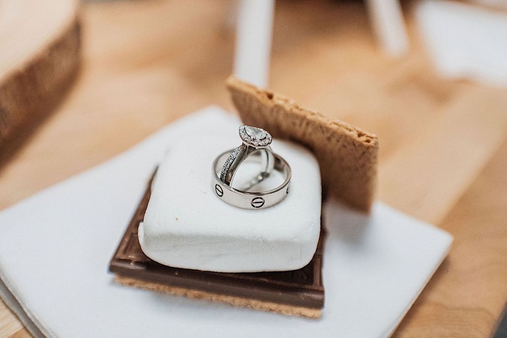 wedding and engagement rings sitting on top of a smores