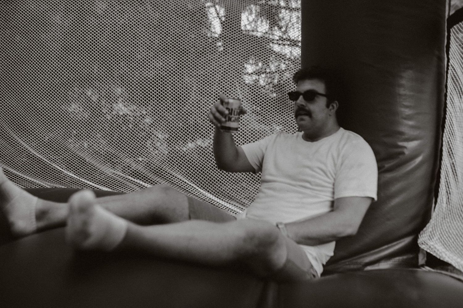 a gentleman sitting on the floor of a bounce house
