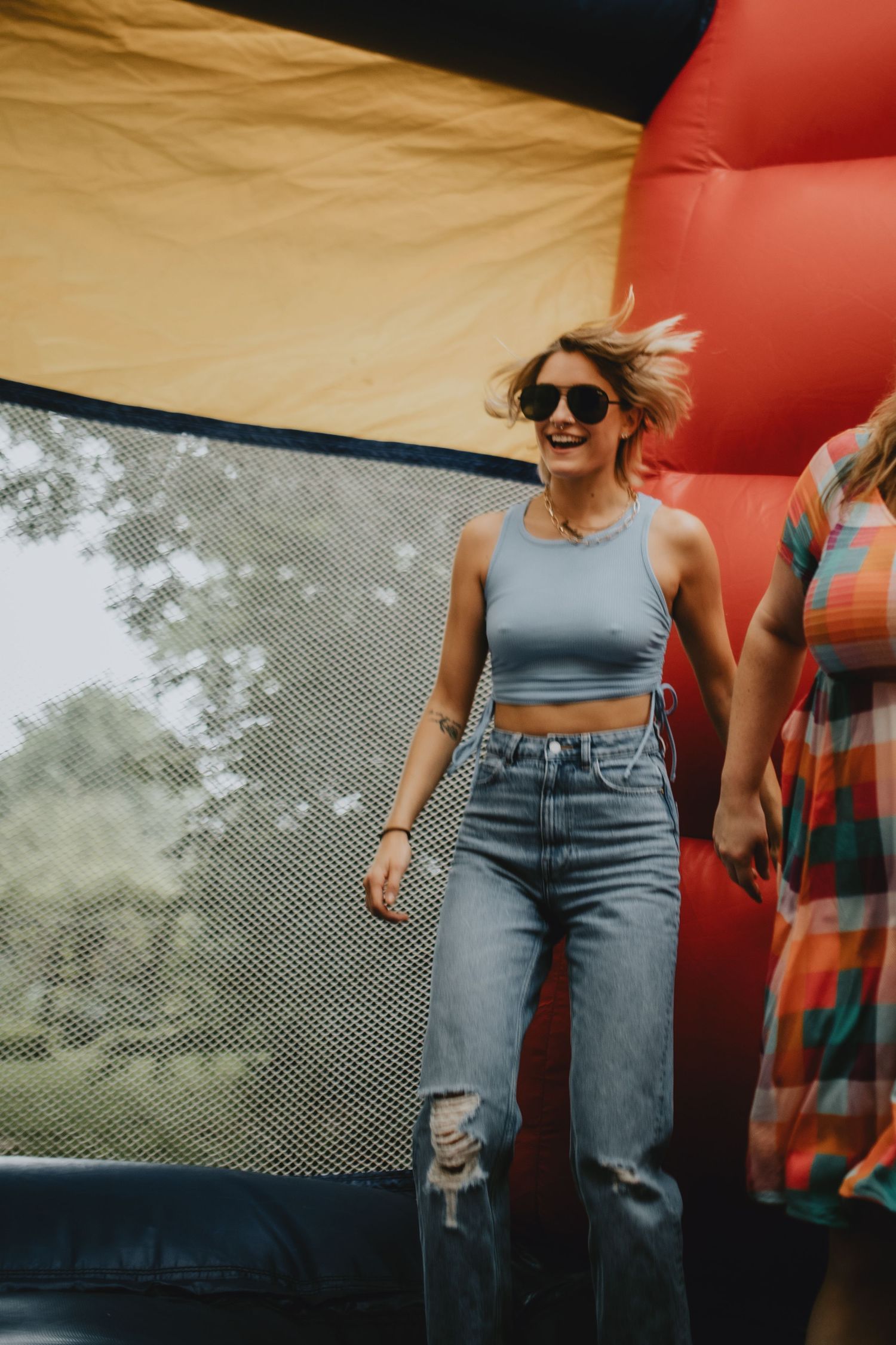 girl jumping in a bounce house