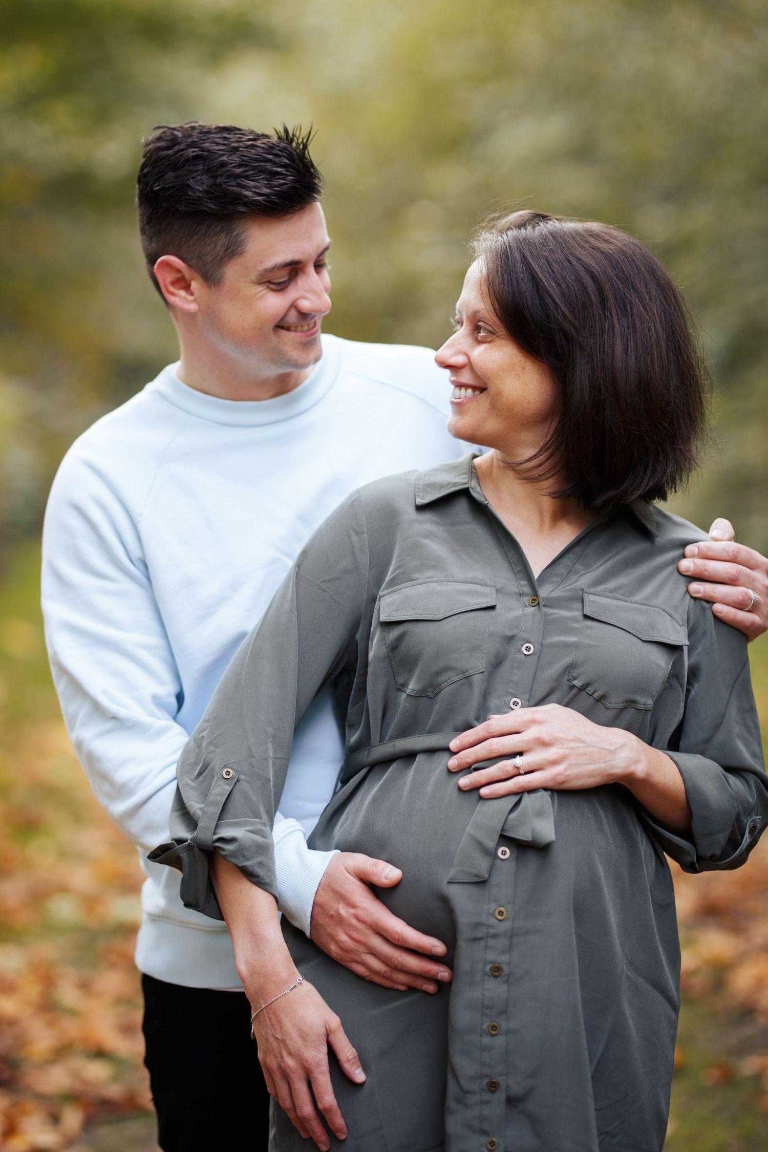 seattle maternity photographer: a couple pose together for their maternity photo session in Willis Tucker Park Snohomish