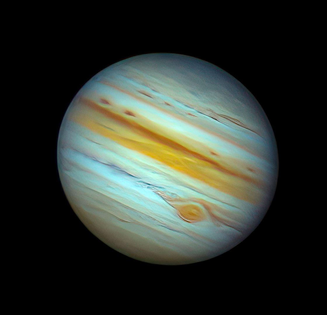 Jupiter's atmospheric bands and Great Red Spot visible in stunning detail from the Hubble Space Telescope.