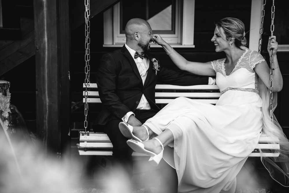 Wedding couple dancing together in elegant formal attire.