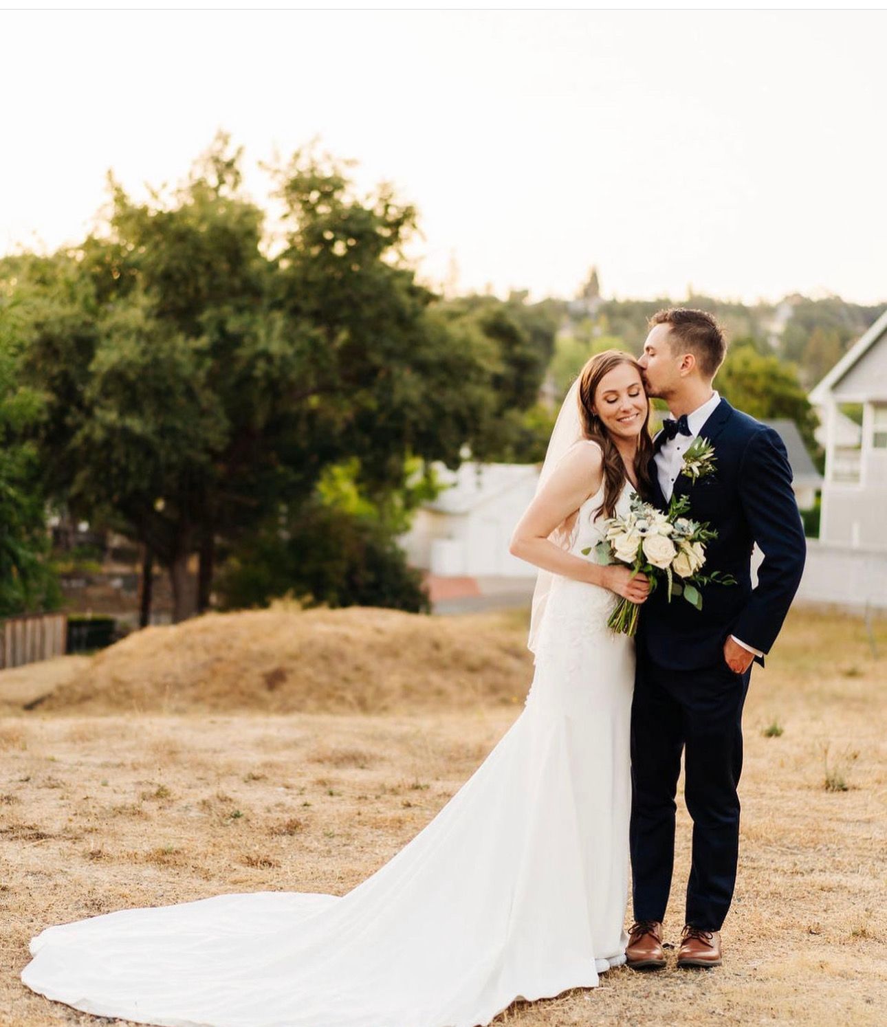 Wedding ceremony at a rustic barn surrounded by beautiful gardens in Sutter Creek, CA