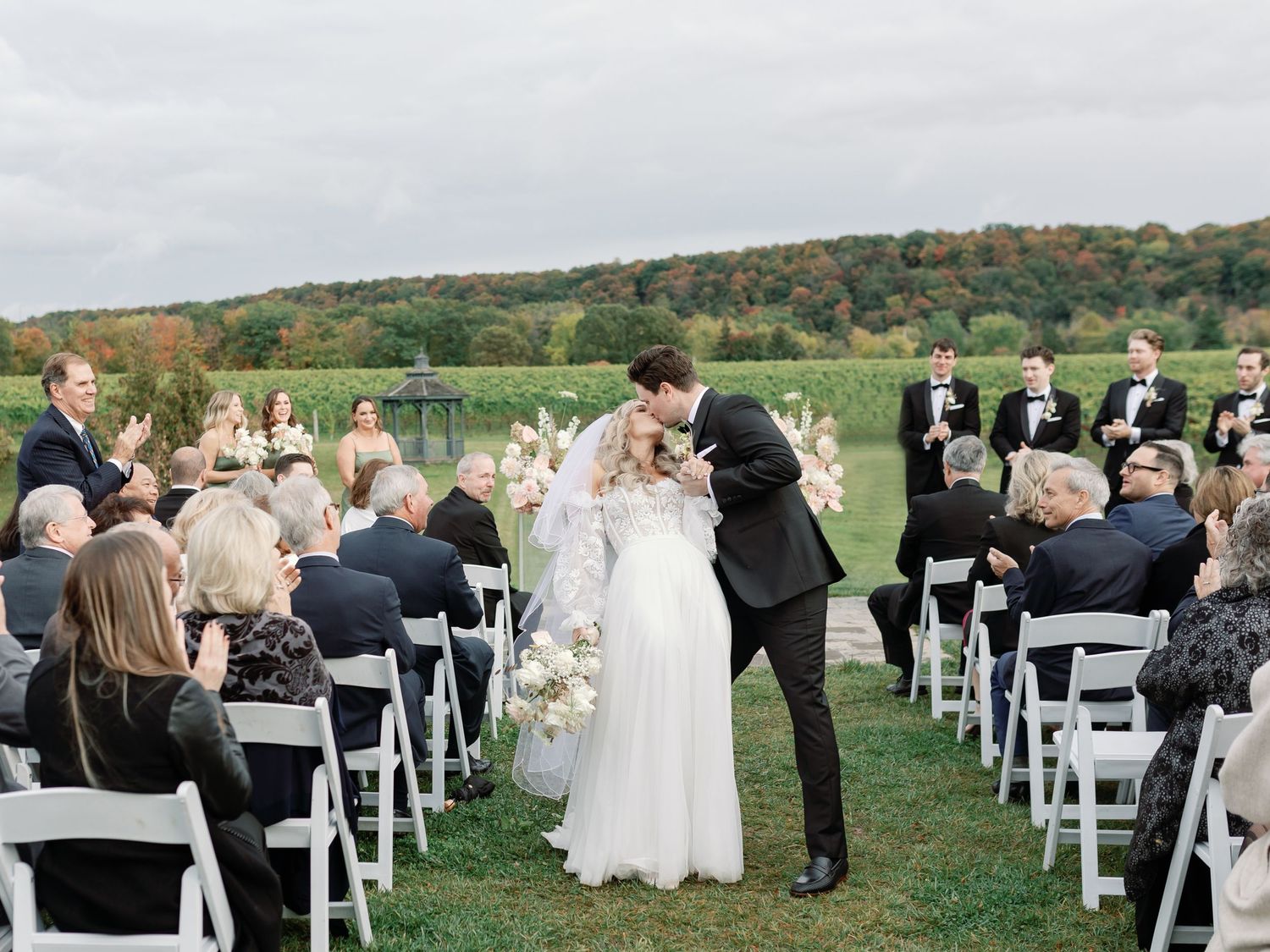 The groom dips his bride for another kiss on his way down the aisle. Photo: Katie Crane Photography.