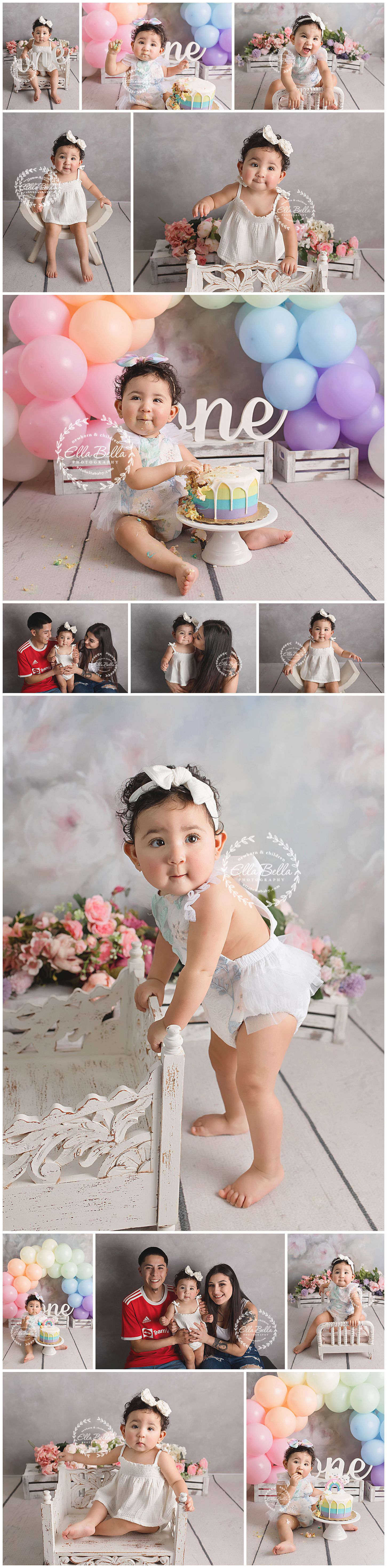 Professional baby milestone photo shoot with pastel balloons, decorative props and white styling elements.